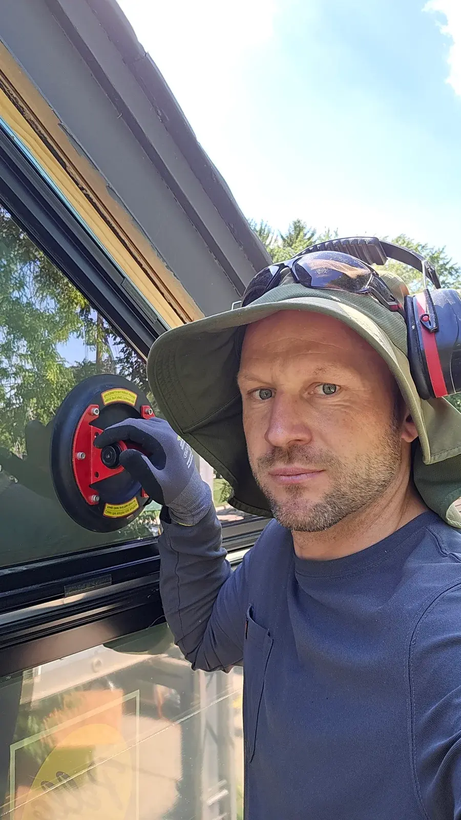 OLKORF Construction owner working on a window installation