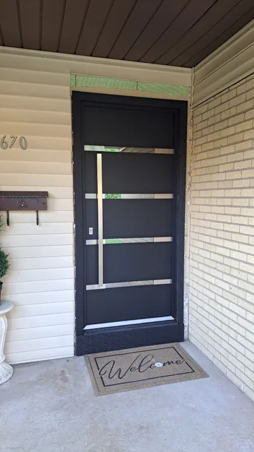 Black entry door with horizontal glass inserts