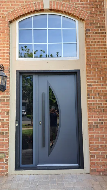 Curved-glass door and brick surround detail