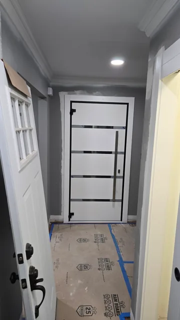 Entry door installation with protected flooring
