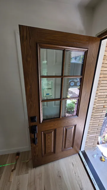 Wood entry door with divided glass