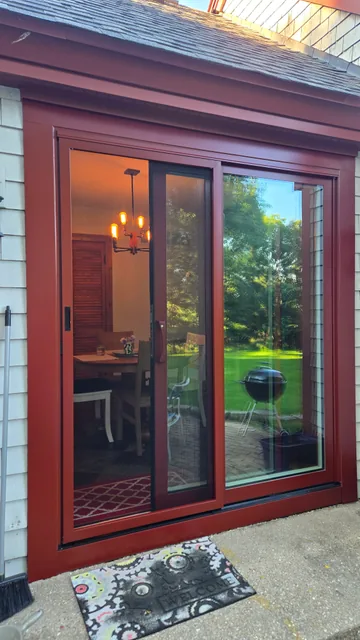 Wood-tone glass patio door assembly
